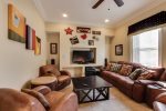 First Floor Media Room with Large Sofa and Chairs, Perfect for Movie or Game Nights